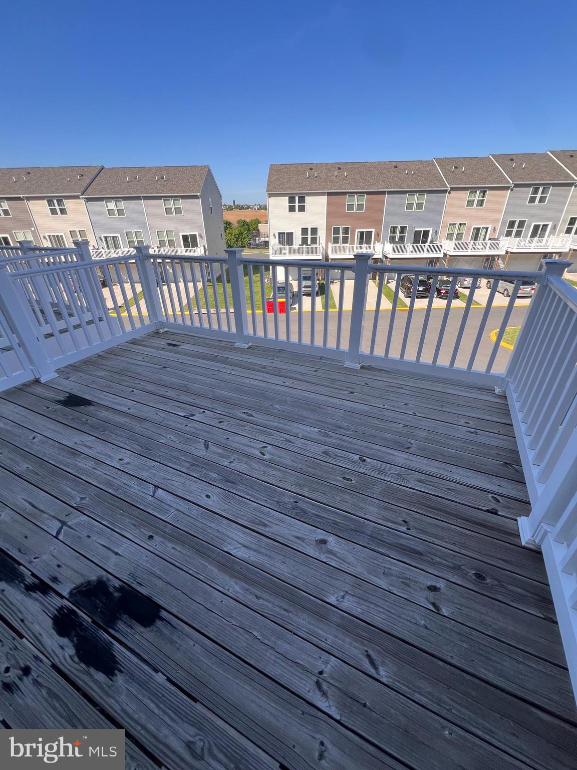 36 Anthem Street Ranson, WV 25438 - Photo 8 of 16 a view of a balcony with wooden floor