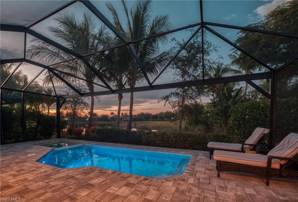 3171 Quilcene Lane Naples, FL 34114 - Photo 14 of 37 a view of a swimming pool with a patio