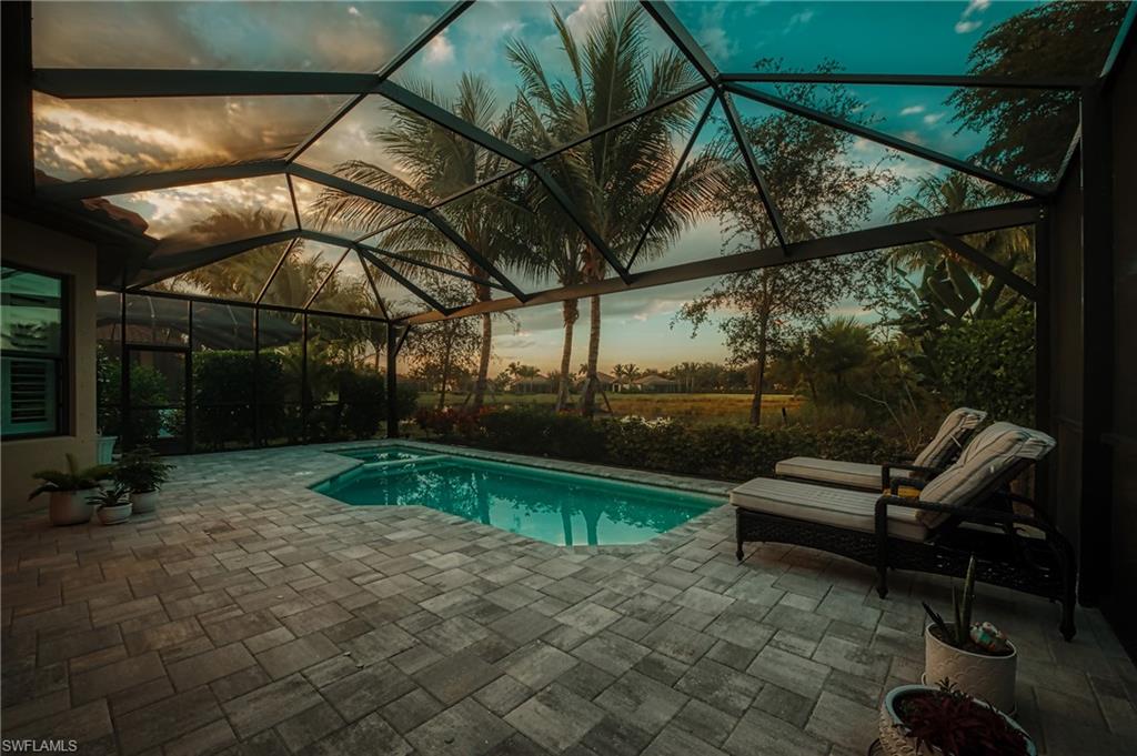 3171 Quilcene Lane Naples, FL 34114 - Photo 2 of 37 a view of a two chairs in the patio