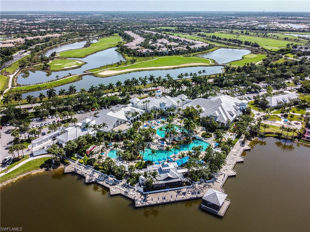 3171 Quilcene Lane Naples, FL 34114 - Photo 32 of 37 an aerial view of a city with a lake view