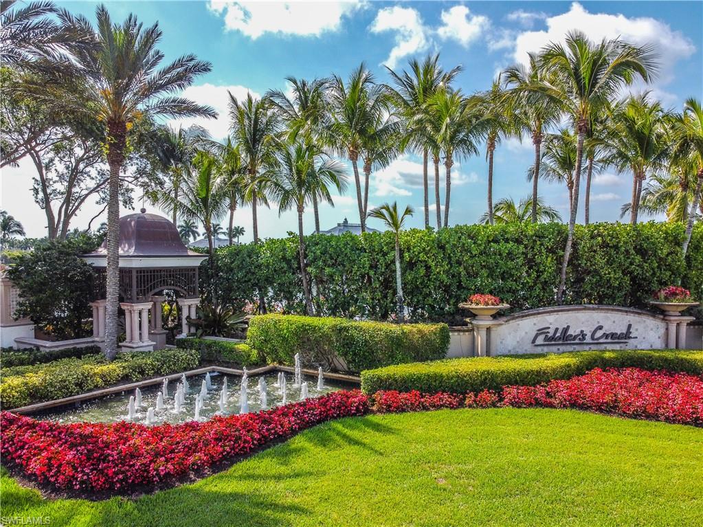 3171 Quilcene Lane Naples, FL 34114 - Photo 36 of 37 a view of swimming pool with lawn chairs and plants