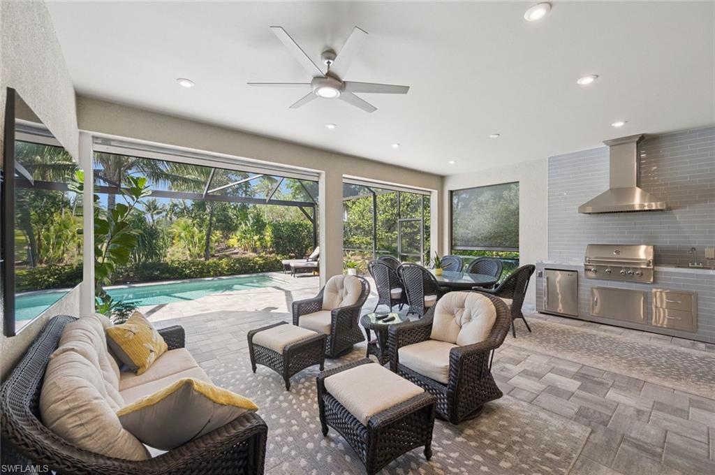 3171 Quilcene Lane Naples, FL 34114 - Photo 4 of 37 a living room with furniture and a large window