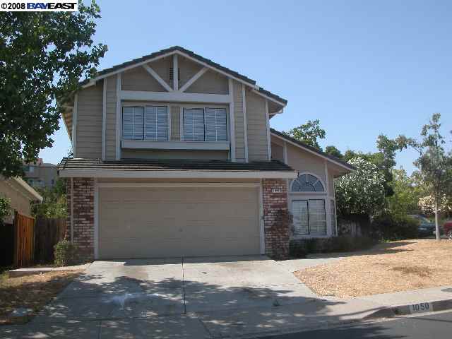 1050 Green Point Court Concord, CA 94521 - Photo 1 of 1 a front view of a house with a yard and garage