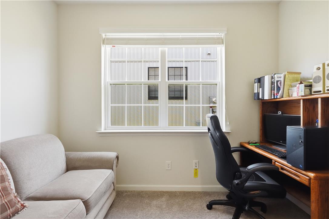 4120 Eveningstar Road Emmaus, PA 18049 - Photo 28 of 62 A well-lit room offers versatility for either relaxation or a productive home office setup.