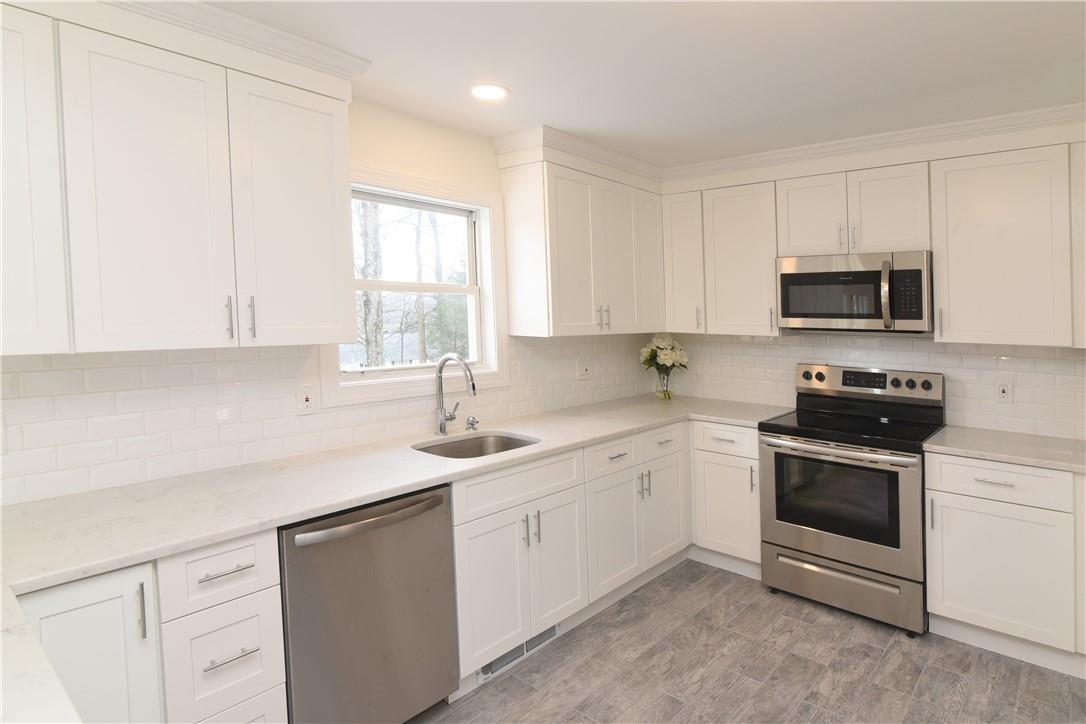 1 Summit Road Mahopac, NY 10541 - Photo 1 of 1 Brand New Kitchen - new granite counter-tops, stainless steel appliances, cabinets and tile back-splash. Newly tiled flooring.