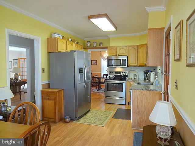 329 Hickory Point Road Pasadena, MD 21122 - Photo 11 of 30 Kitchen w/ Stainless Steel Appliances