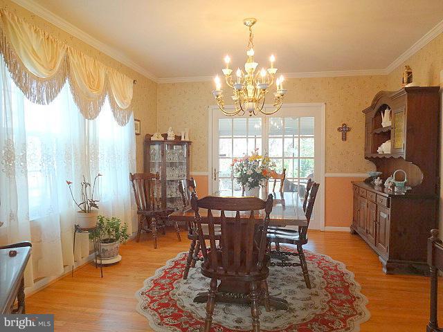 329 Hickory Point Road Pasadena, MD 21122 - Photo 9 of 30 Dining Room w/ French Doors to Screened Porch