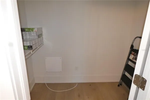 a view of storage and utility room with stairs