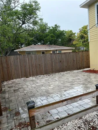a view of wooden fence and trees