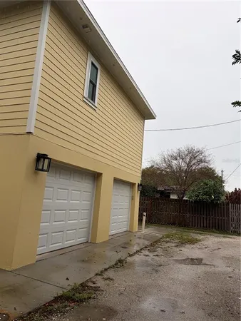 a front view of a house with garage