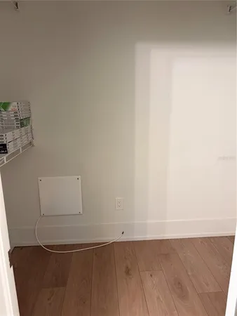 an empty room with wooden floor