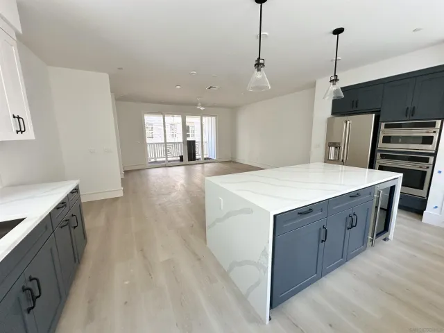 a kitchen with sink and cabinets