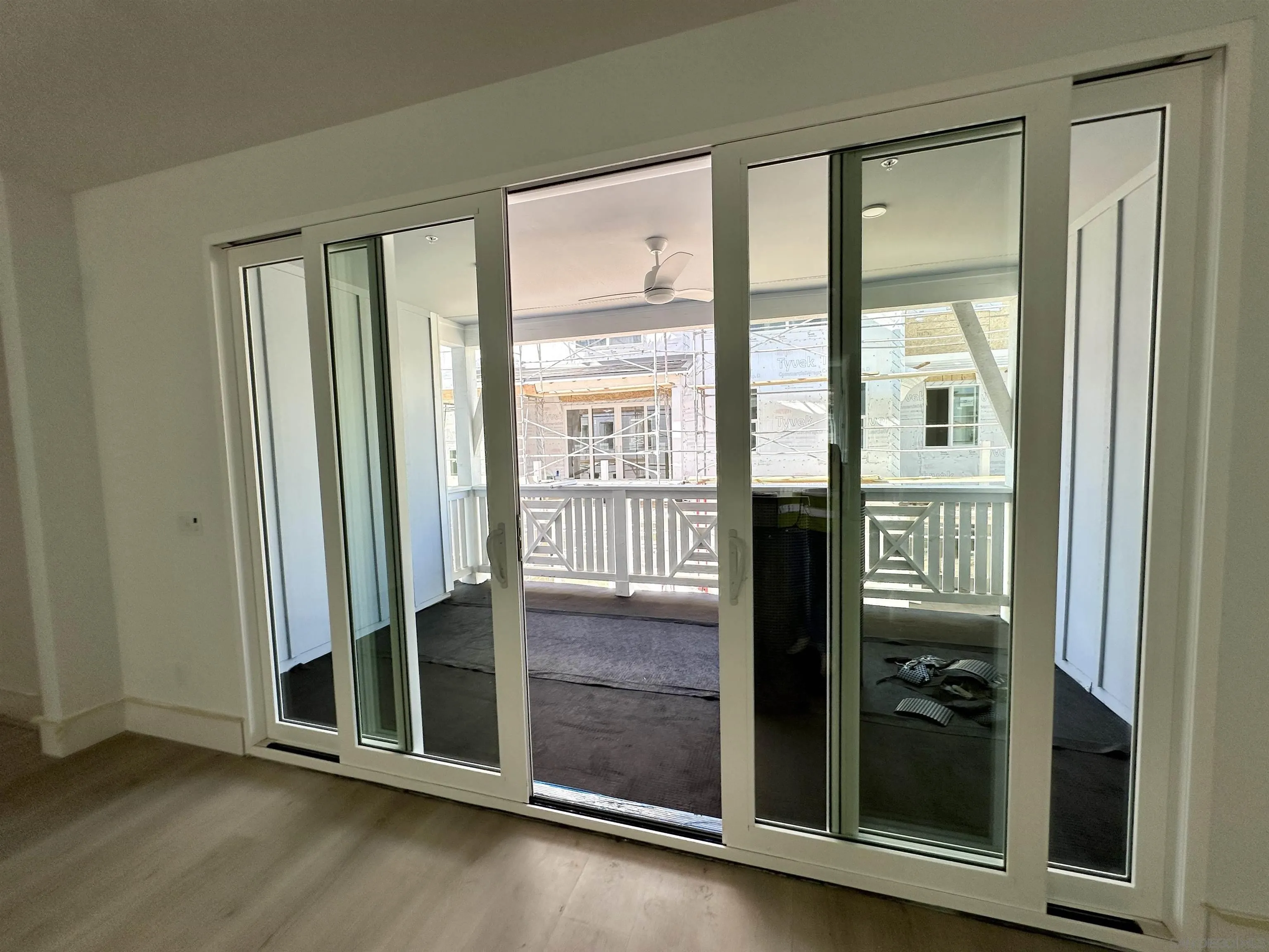 7290 Ponto Drive South, Unit 207 Carlsbad, CA 92011 - Photo 28 of 32 an empty room with floor to ceiling windows