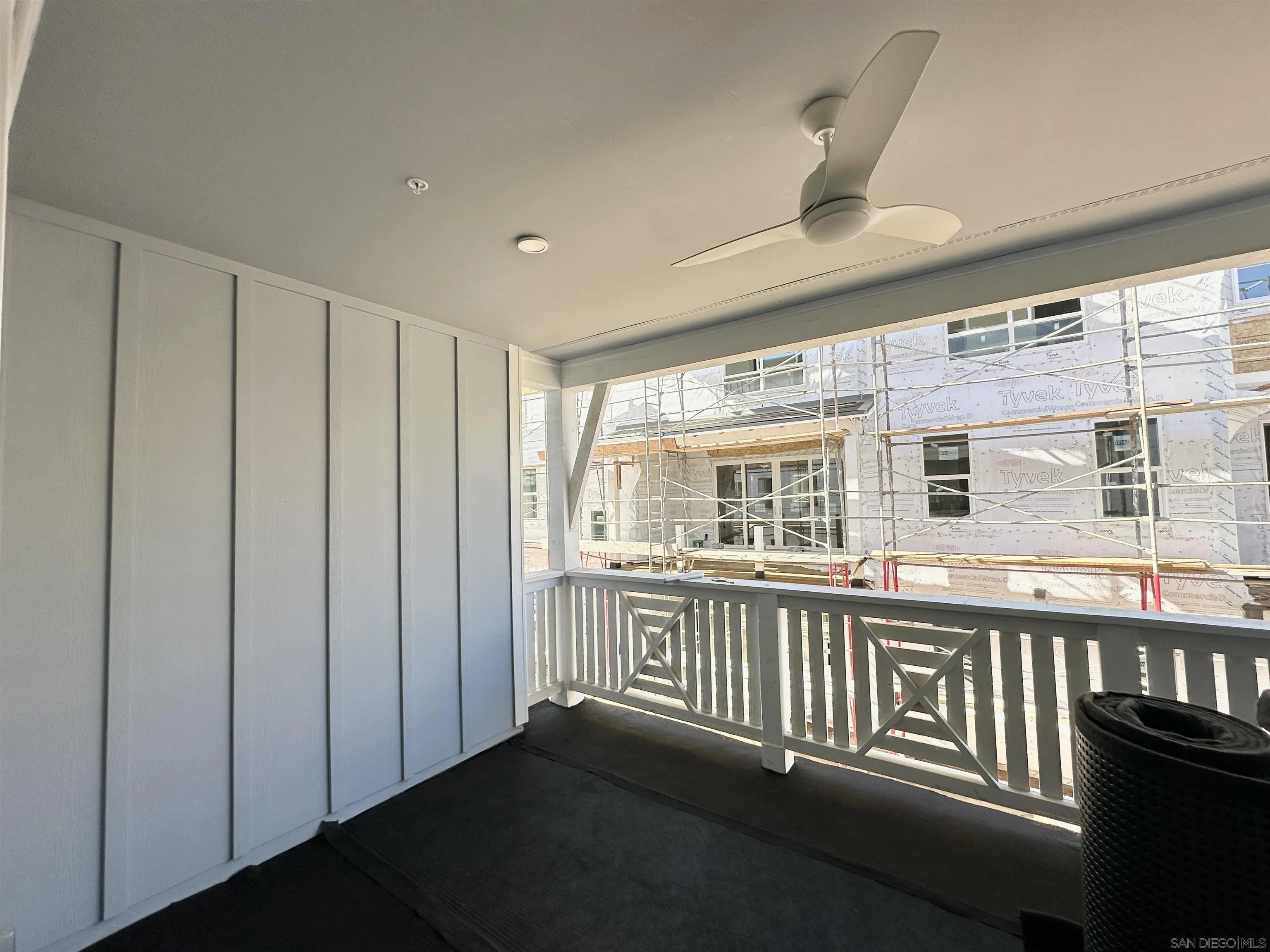7290 Ponto Drive South, Unit 207 Carlsbad, CA 92011 - Photo 29 of 32 a view of a porch with wooden floor and fence