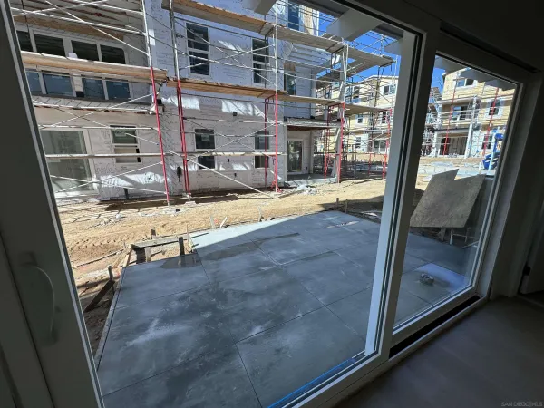 a view of lobby with a door and balcony