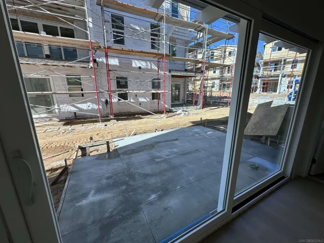 a view of lobby with a door and balcony