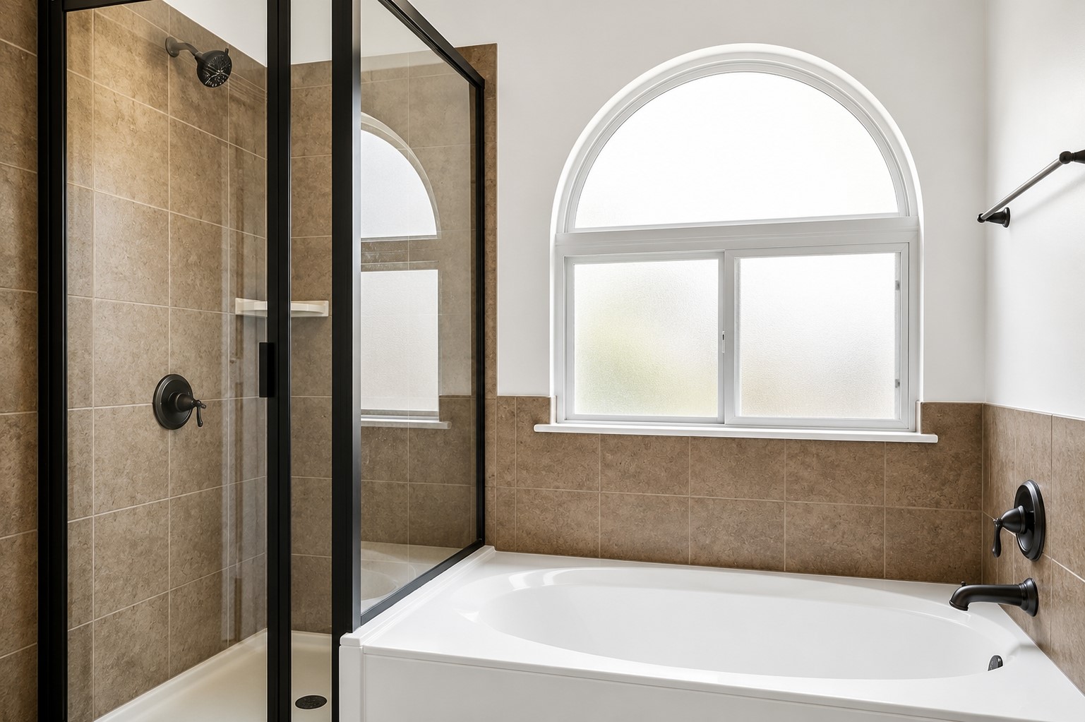 304 Santa Maria Street Georgetown, TX 78628 - Photo 21 of 37 Soaking tub and enclosed shower offer a pristine bathing experience with ample natural light.