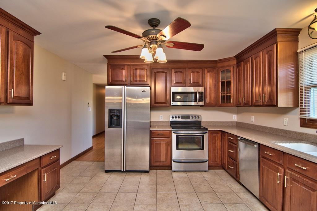 43 Hildebrandt Road Dallas, PA 18612 - Photo 13 of 54 a kitchen with stainless steel appliances granite countertop a stove cabinets and refrigerator