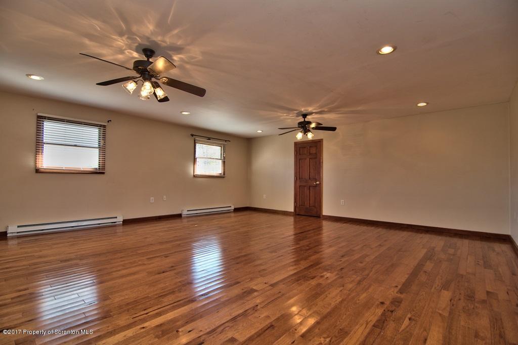 43 Hildebrandt Road Dallas, PA 18612 - Photo 20 of 54 a view of an empty room with wooden floor and a ceiling fan