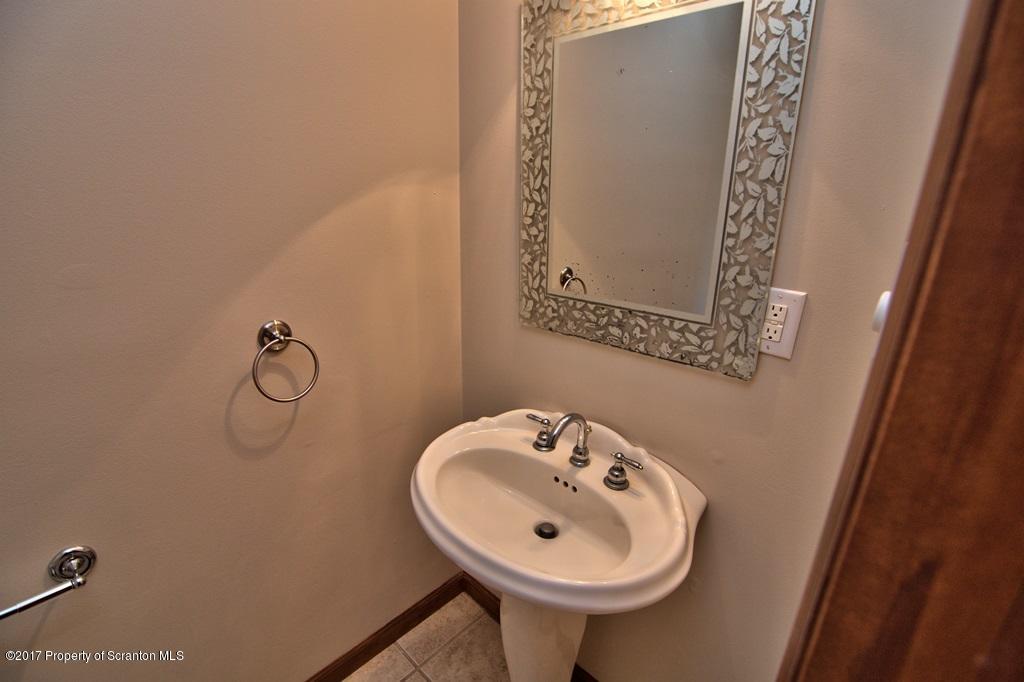 43 Hildebrandt Road Dallas, PA 18612 - Photo 23 of 54 a bathroom with a sink and mirror