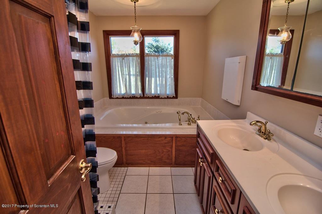 43 Hildebrandt Road Dallas, PA 18612 - Photo 28 of 54 a bathroom with a sink a toilet and shower
