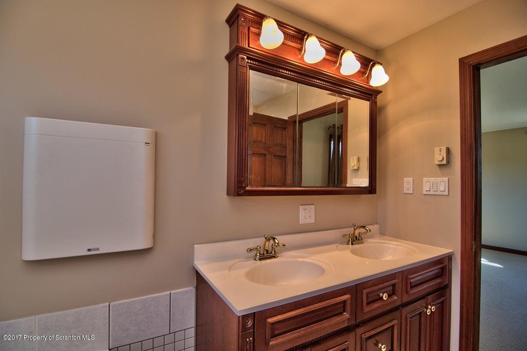 43 Hildebrandt Road Dallas, PA 18612 - Photo 30 of 54 a bathroom with a sink and a mirror