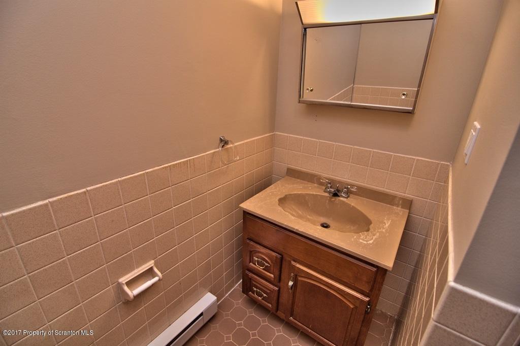 43 Hildebrandt Road Dallas, PA 18612 - Photo 36 of 54 a bathroom with a sink a vanity and a mirror