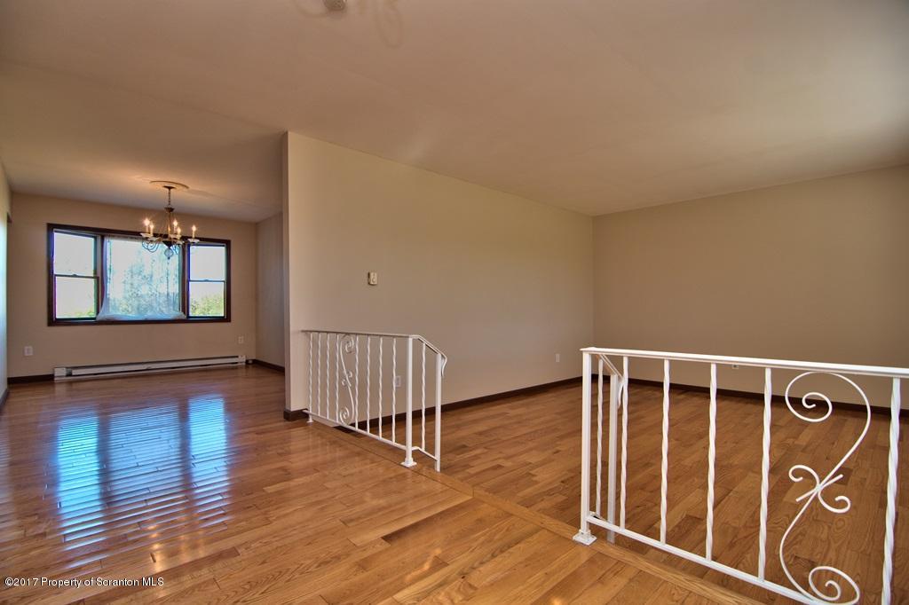 43 Hildebrandt Road Dallas, PA 18612 - Photo 4 of 54 a view of an empty room with wooden floor and a window