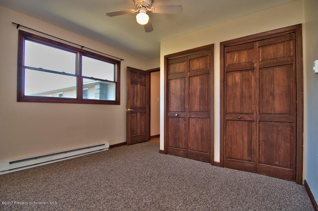 43 Hildebrandt Road Dallas, PA 18612 - Photo 41 of 54 an empty room with windows closet and chandelier fan