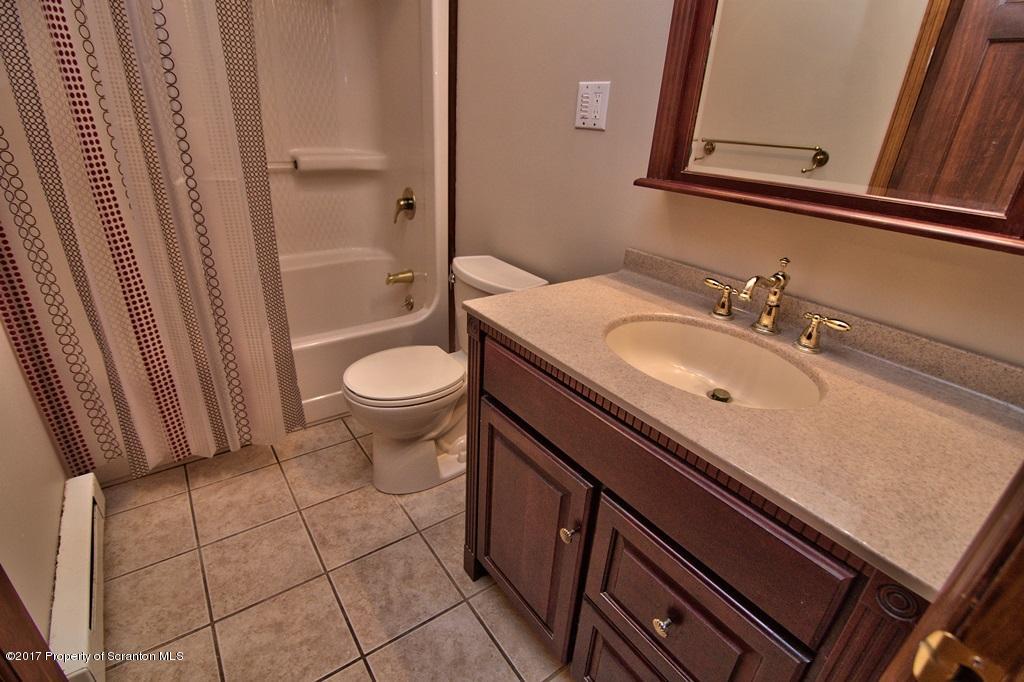 43 Hildebrandt Road Dallas, PA 18612 - Photo 44 of 54 a bathroom with a sink a toilet and shower