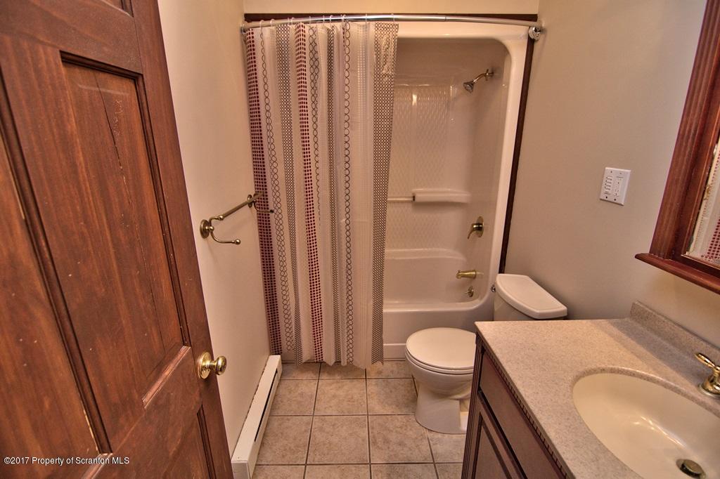 43 Hildebrandt Road Dallas, PA 18612 - Photo 45 of 54 a bathroom with a granite countertop toilet and a sink