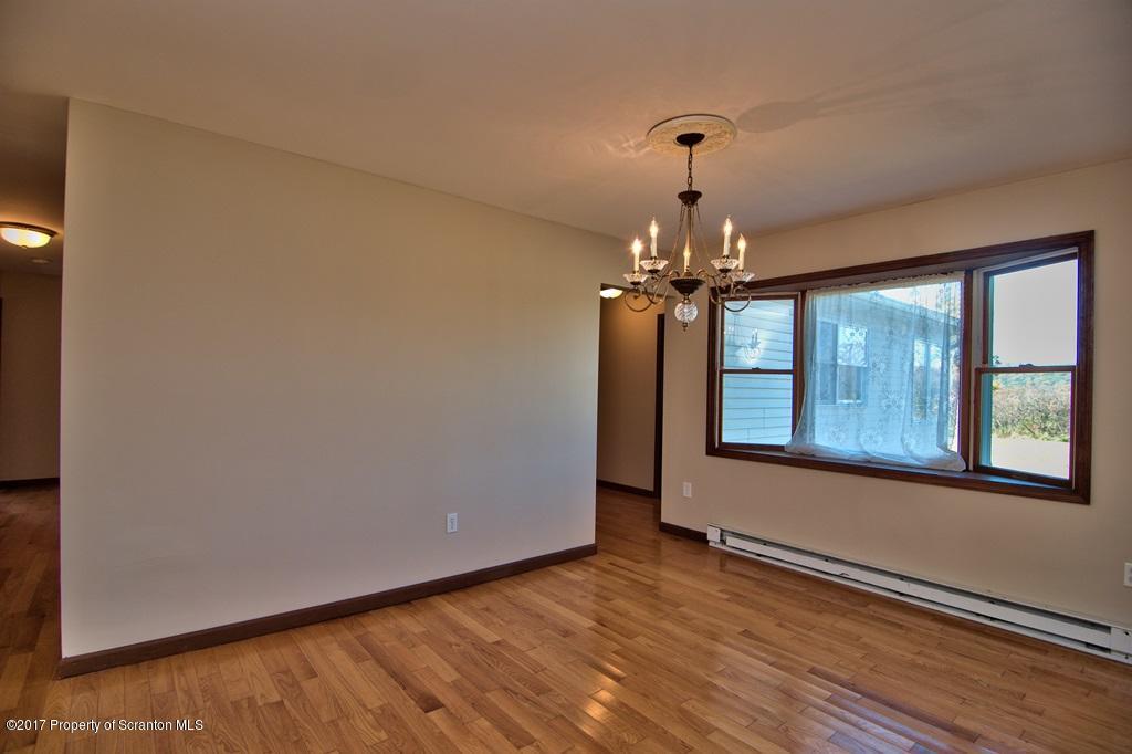 43 Hildebrandt Road Dallas, PA 18612 - Photo 9 of 54 a view of a room with a large window and wooden floor