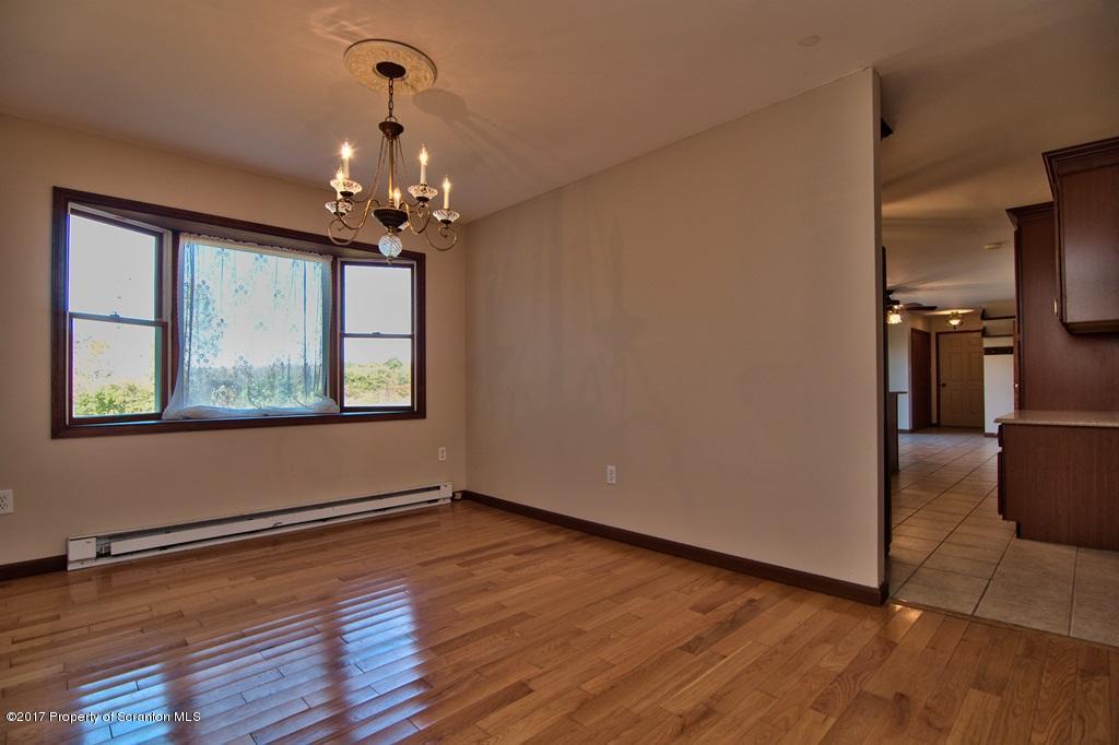 43 Hildebrandt Road Dallas, PA 18612 - Photo 10 of 54 a view of a room with window wooden floor and a ceiling fan