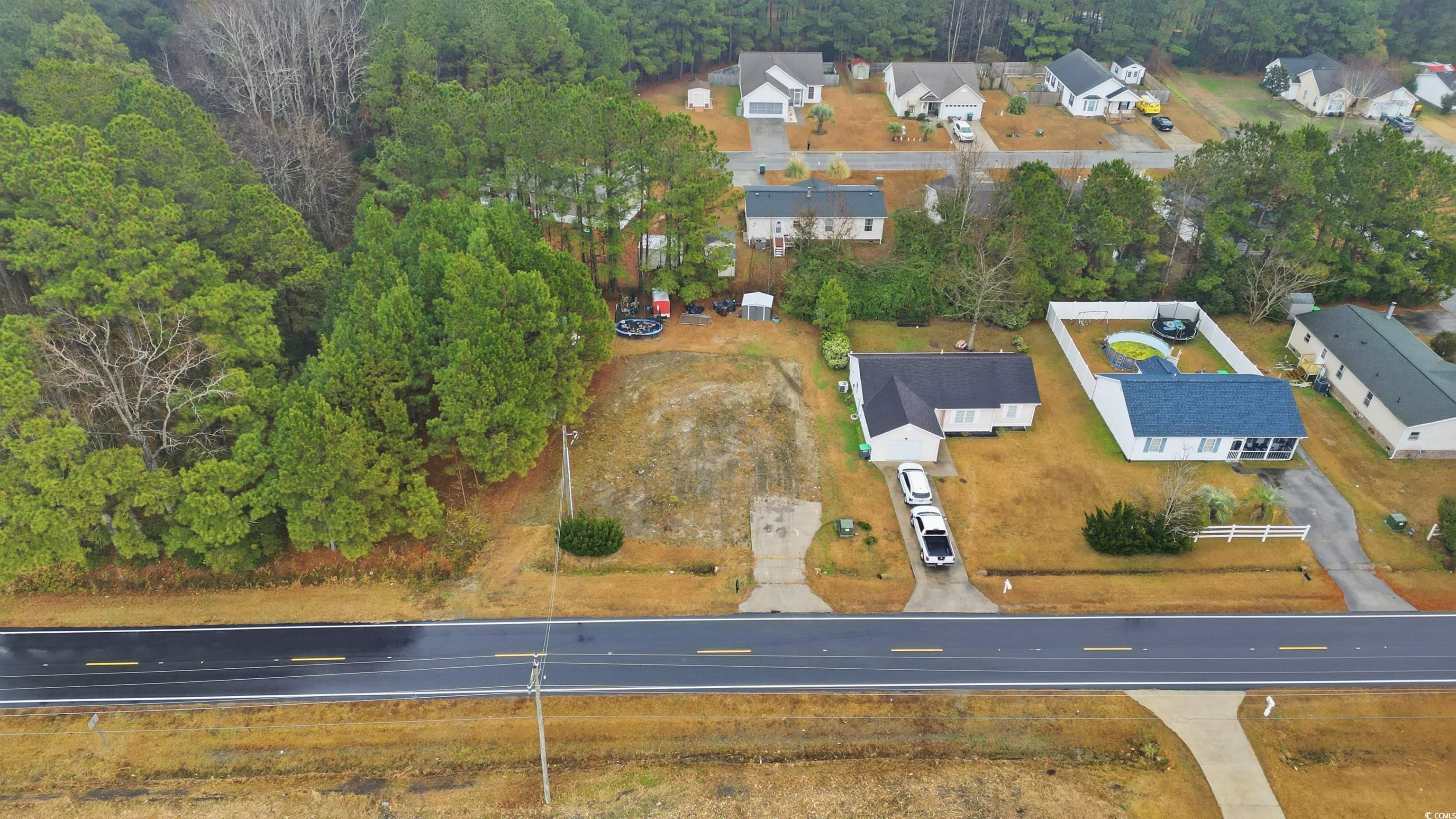 5176 Spring Street Loris, SC 29569 - Photo 3 of 12 Aerial overview of property's location featuring nearby suburban area
