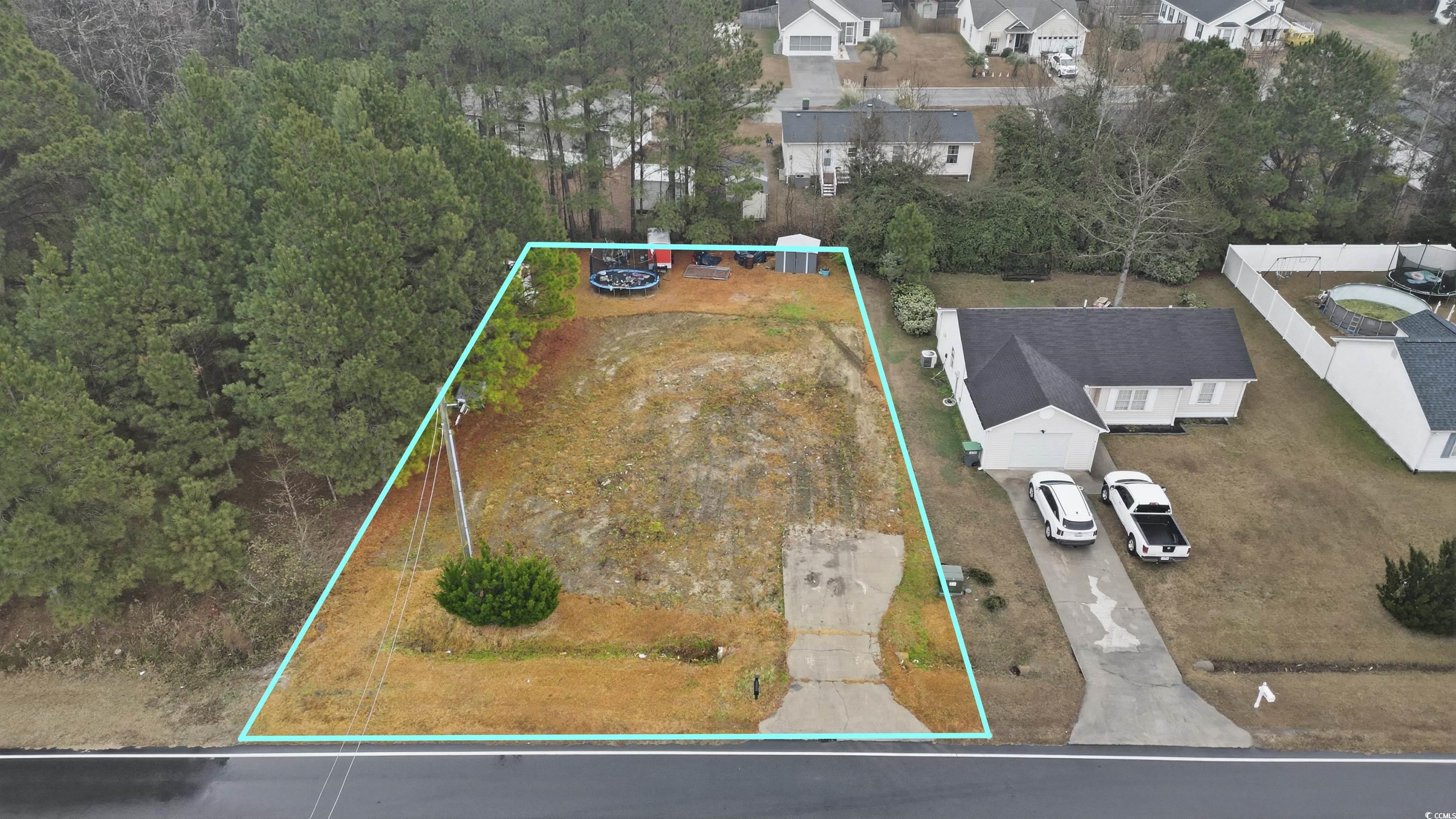 5176 Spring Street Loris, SC 29569 - Photo 10 of 12 Aerial view of residential area with property parcel outlined