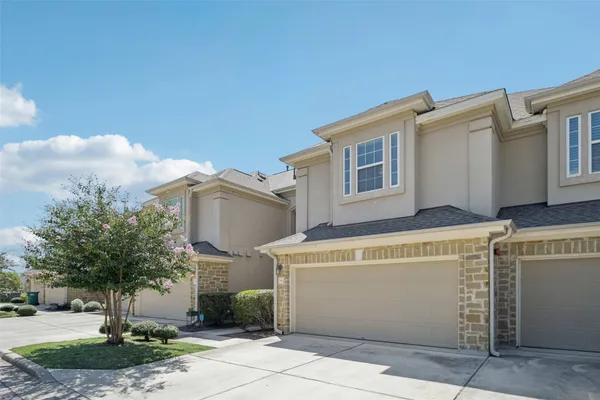 a view of a white building with many windows