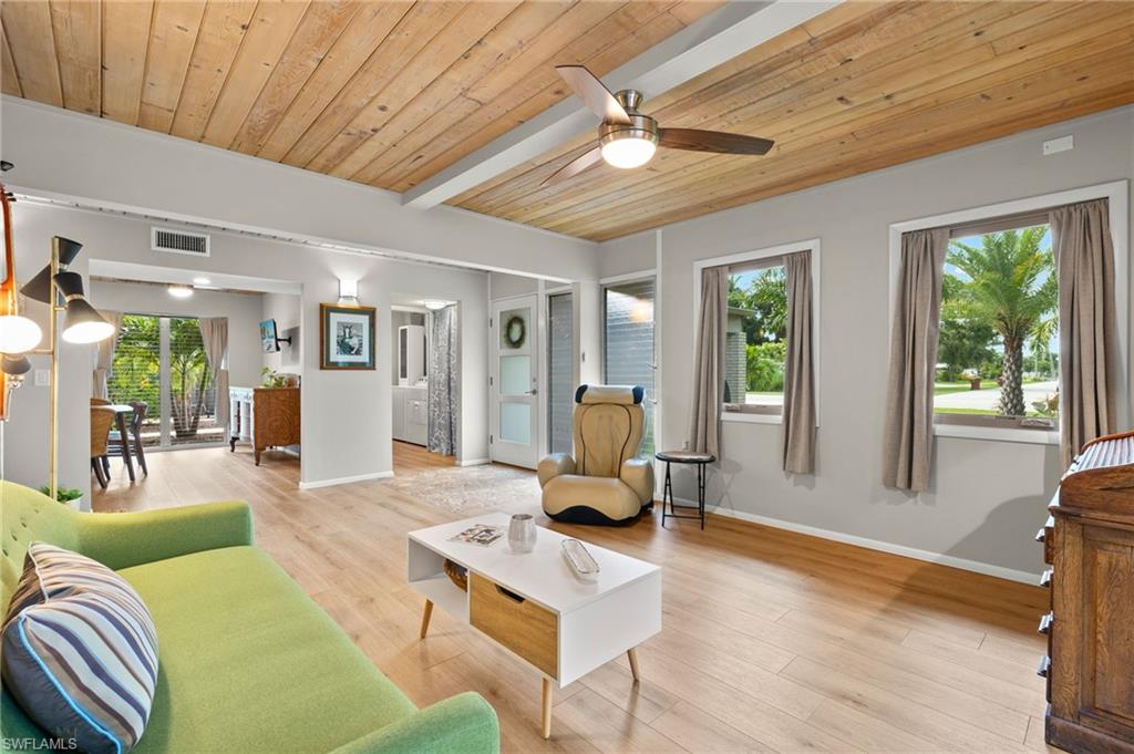 1599 Grove Avenue Fort Myers, FL 33901 - Photo 11 of 25 a living room with furniture floor to ceiling window and wooden floor