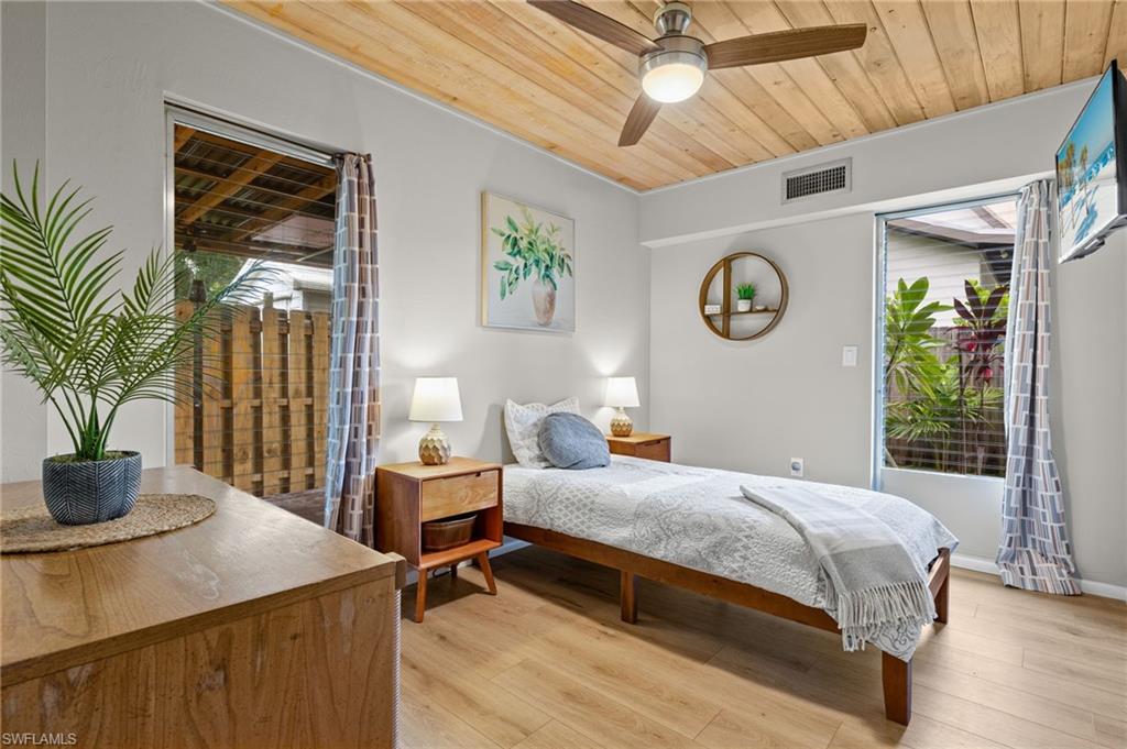 1599 Grove Avenue Fort Myers, FL 33901 - Photo 18 of 25 a bedroom with a bed and a window