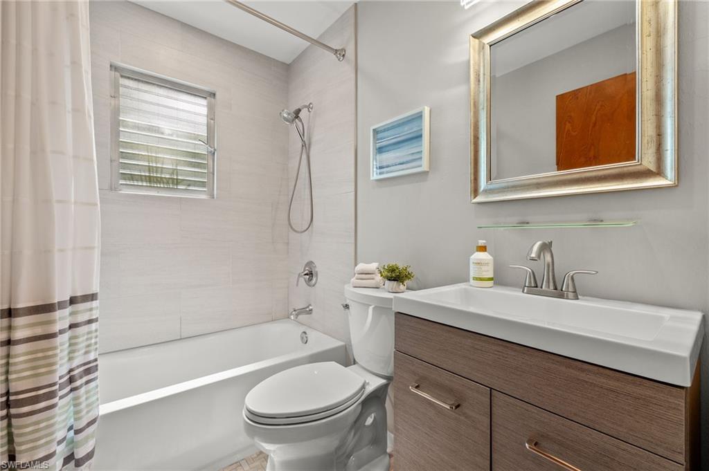 1599 Grove Avenue Fort Myers, FL 33901 - Photo 19 of 25 a bathroom with a sink a toilet and shower