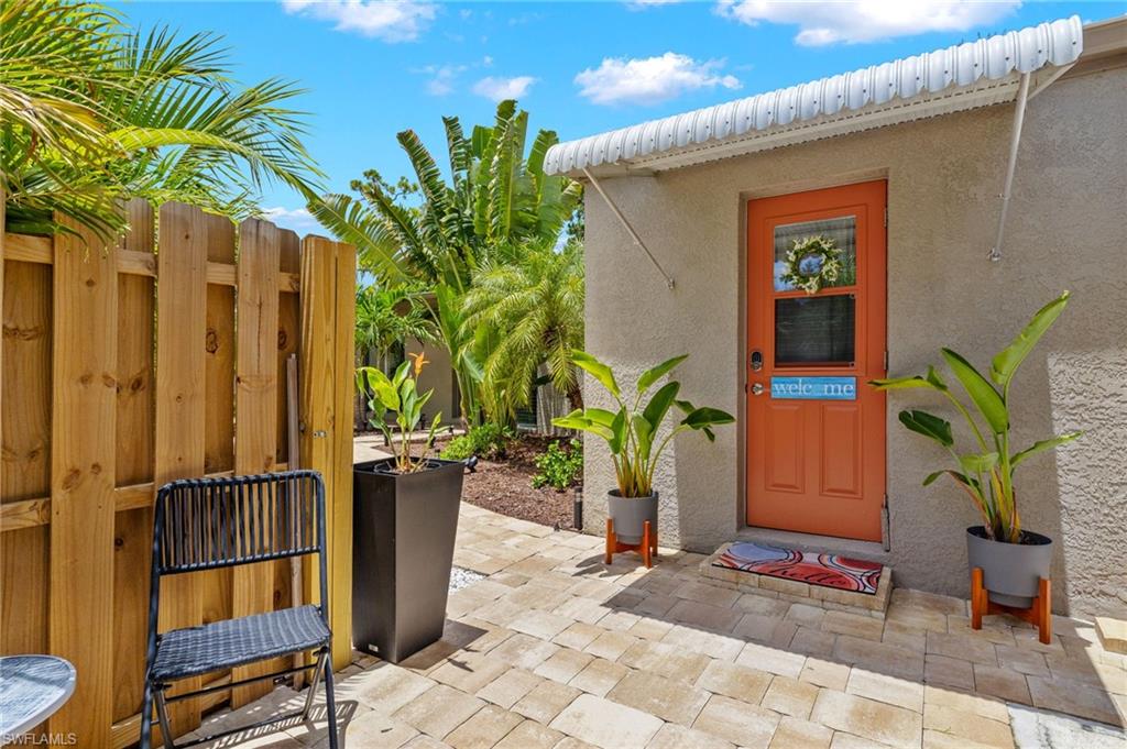 1599 Grove Avenue Fort Myers, FL 33901 - Photo 23 of 25 a potted plant sitting in front of a door