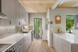 a kitchen with a sink and a refrigerator