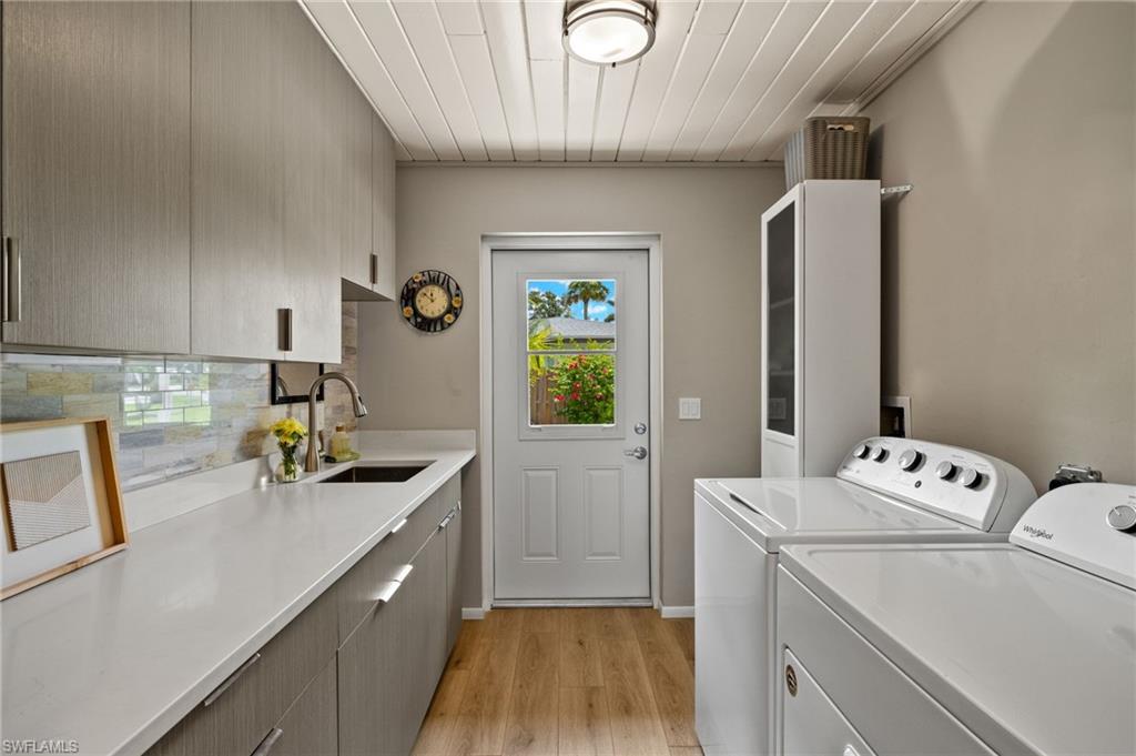 1599 Grove Avenue Fort Myers, FL 33901 - Photo 10 of 25 a kitchen that has a sink and a stove in it