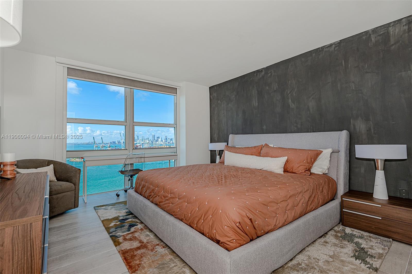 90 Alton Road, Unit 2506 Miami Beach, FL 33139 - Photo 15 of 22 a bedroom with a bed and window