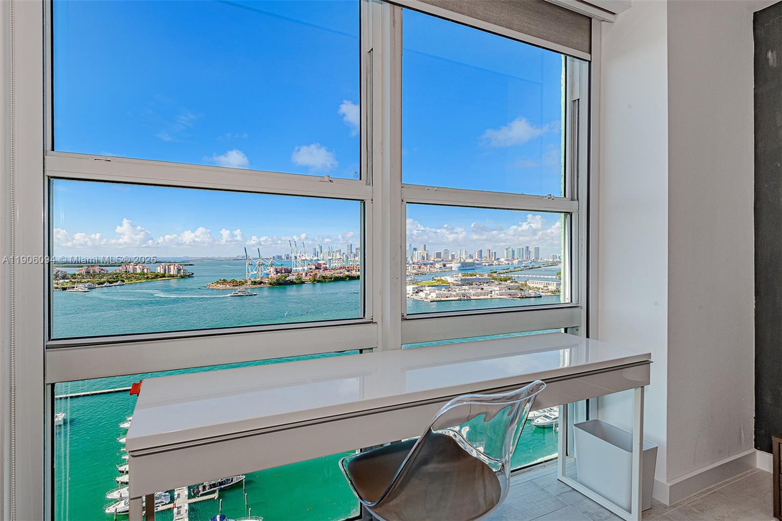 90 Alton Road, Unit 2506 Miami Beach, FL 33139 - Photo 18 of 22 a view of a two chairs in the room