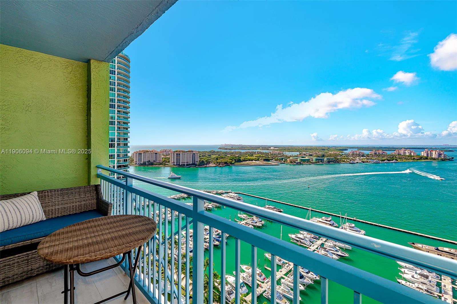 90 Alton Road, Unit 2506 Miami Beach, FL 33139 - Photo 21 of 22 a view of a two chairs on the roof deck