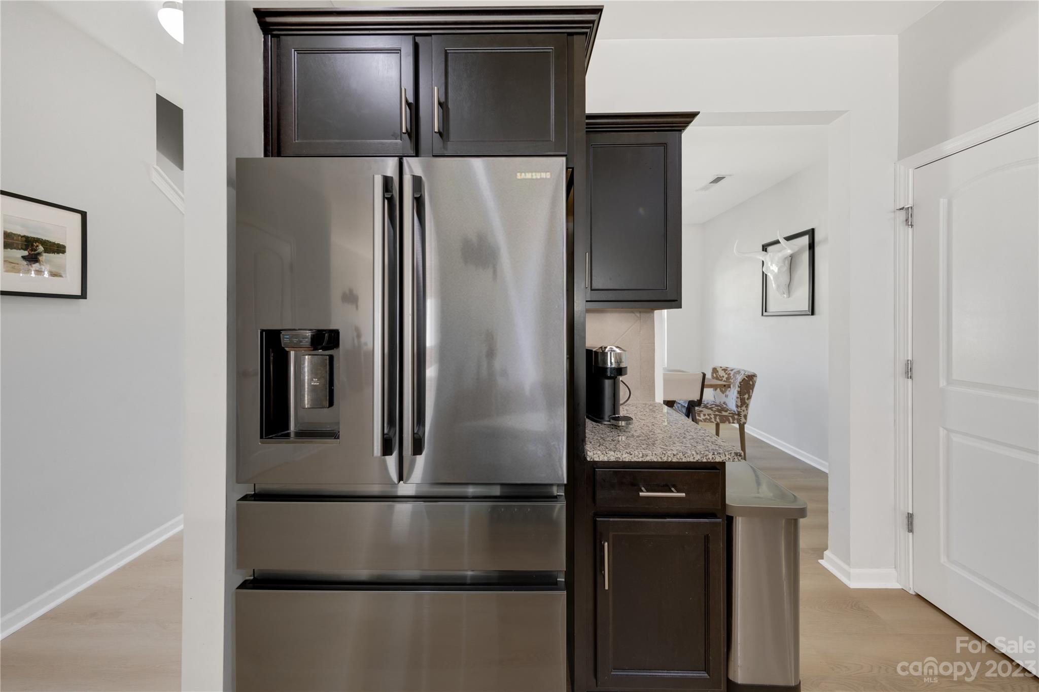 360 Wyndham Forest Circle Midland, NC 28107 - Photo 15 of 40 a metallic refrigerator freezer sitting in a kitchen