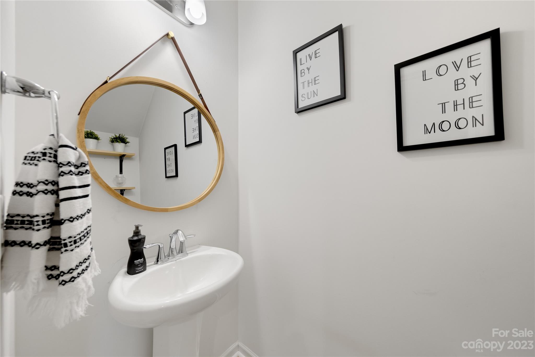 360 Wyndham Forest Circle Midland, NC 28107 - Photo 16 of 40 a bathroom with a sink mirror and vanity