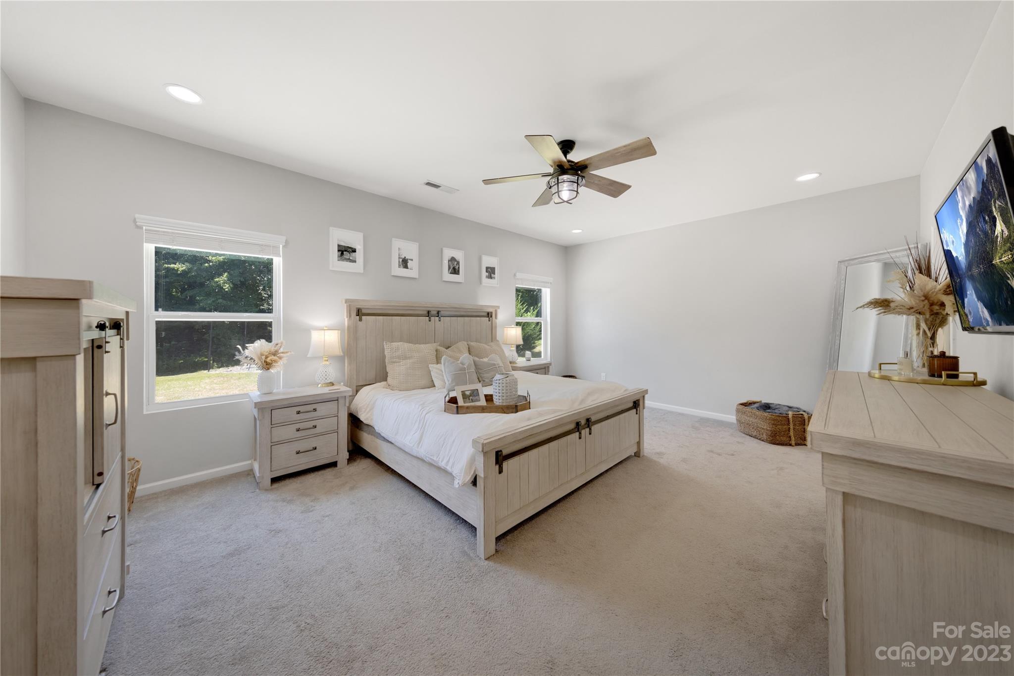 360 Wyndham Forest Circle Midland, NC 28107 - Photo 19 of 40 a bed room with a bed a window and a television