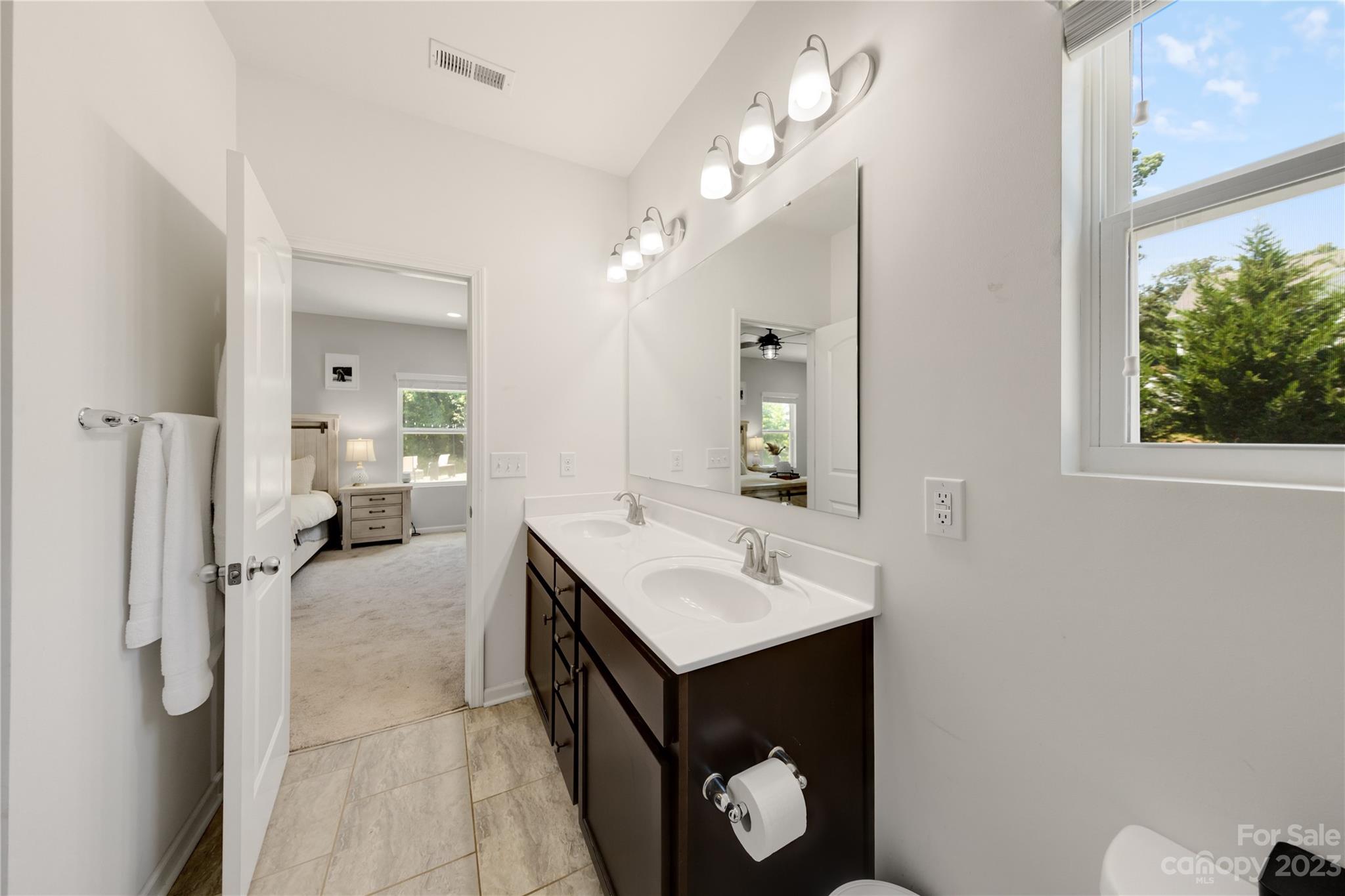 360 Wyndham Forest Circle Midland, NC 28107 - Photo 21 of 40 a bathroom with a sink vanity and a mirror
