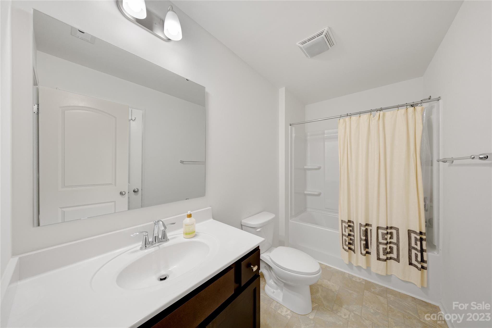 360 Wyndham Forest Circle Midland, NC 28107 - Photo 25 of 40 a bathroom with a sink a toilet and shower